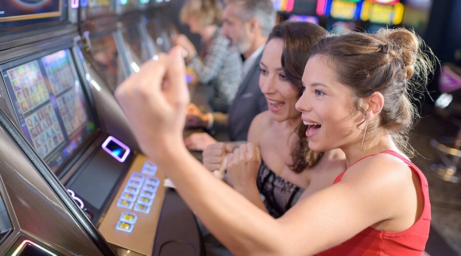 Women Playing Gaming Machine