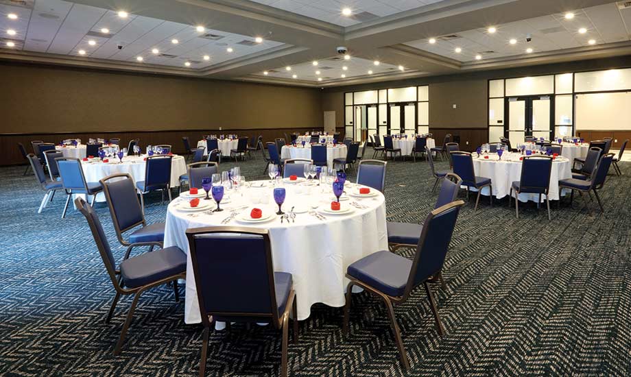 Image shows the banquet area of the Grandstand with tables set for an event