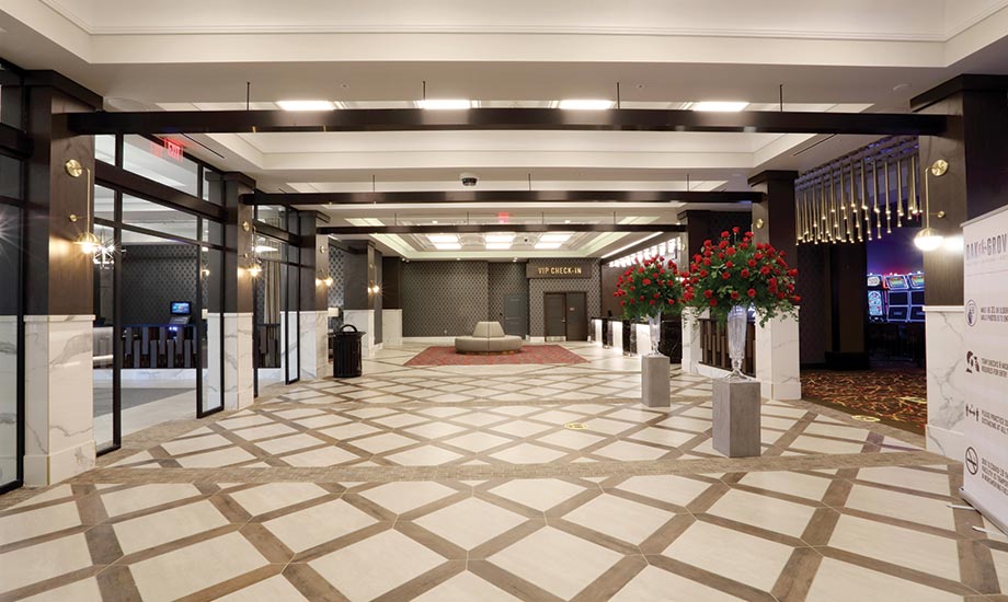 Image of the hotel lobby shows the hotel entrance to the left and gaming floor entrance to the right with the front desk and VIP check in areas