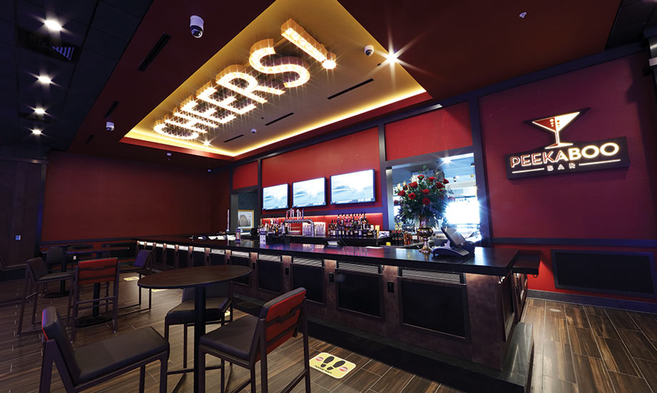 Image shows the Peek-a-Boo bar with the "Cheers!" marquee lights in the ceiling