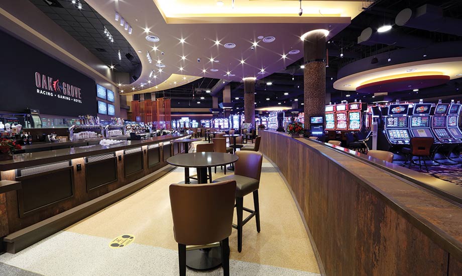 Image shows seating area in Sports Bar with the Bar to the left and the games on the gaming floor to the right