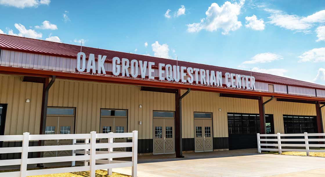 Angled view of the front entrance of the Oak Grove Equestrian Center