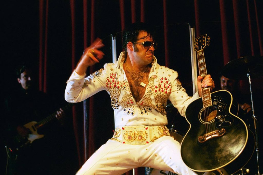 Image of "Tribute to the King" Elvis impersonator with guitar