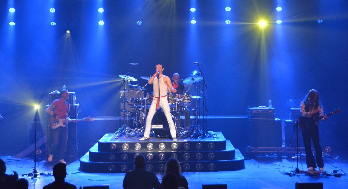 Image of Gary Mullen and The Works on stage performing Queen tribute music